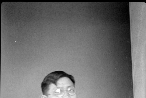 Portrait of man sitting at a table (ddr-densho-426-2003)