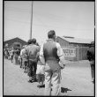 Japanese Americans waiting in mess hall line (ddr-densho-151-347)