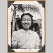 Smiling girl outside a home (ddr-densho-542-222)