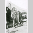 Soldier with flag in front of tent (ddr-densho-1007-833)