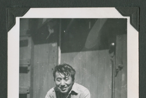 Man sitting on steps (ddr-densho-471-182)