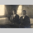 Two men seated at a table (ddr-njpa-4-2244)