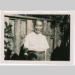 Man standing by fence (ddr-densho-426-1121)