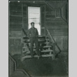 Man standing on stairs of barracks (ddr-ajah-2-294)