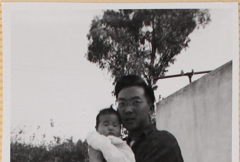 Susan Shiomi being held by a man (ddr-densho-522-140)