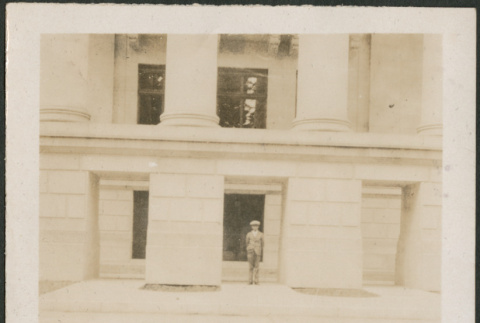 Man outside large building (ddr-densho-316-235)
