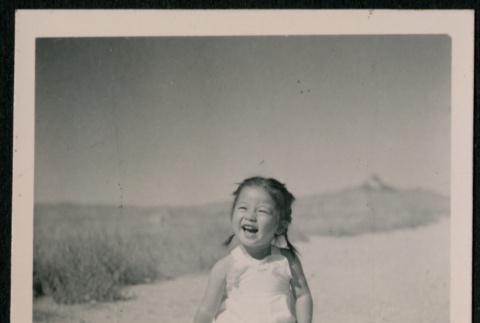 Japanese American girl toddler sitting on the ground (ddr-densho-362-50)