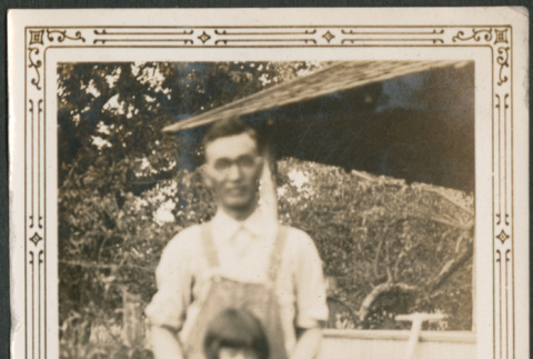 Man and girl outside house (ddr-densho-316-228)