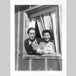 Nisei man and woman in barracks window (ddr-densho-157-36)