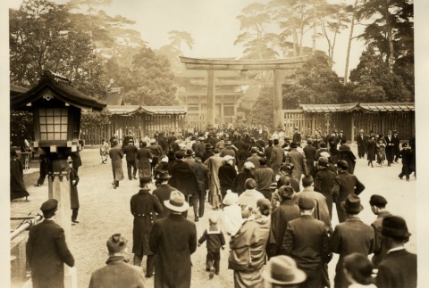 Men, women and children walking through the gates of a shrine (ddr-njpa-8-43)