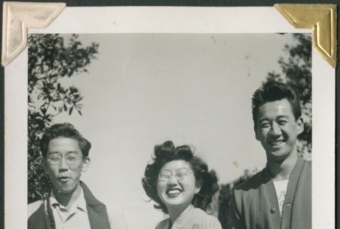Woman and three men laughing (ddr-densho-321-194)