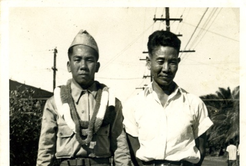 Danny Y. Teruda standing next to a man (ddr-densho-22-300)