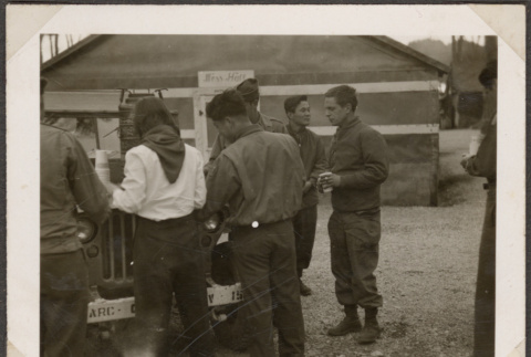 Group of men in uniform getting coffee (ddr-densho-466-4)