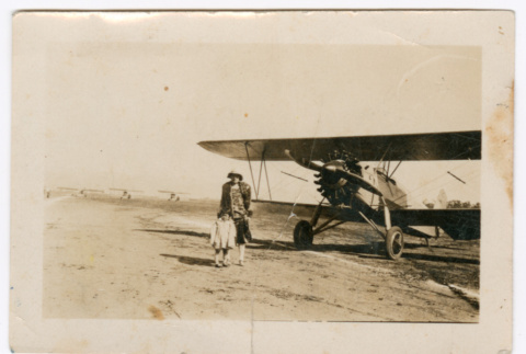 Woman and girl next to airplane (ddr-densho-480-81)