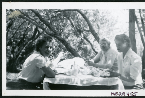 Photograph of L. Josephine Hawes, Edna Anderson, and Eleanor Thomas at a picnic table (ddr-csujad-47-306)