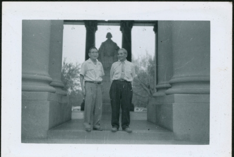 Two men standing by monument (ddr-densho-293-183)
