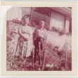 Man and woman standing in garden in front of house (ddr-densho-332-22)