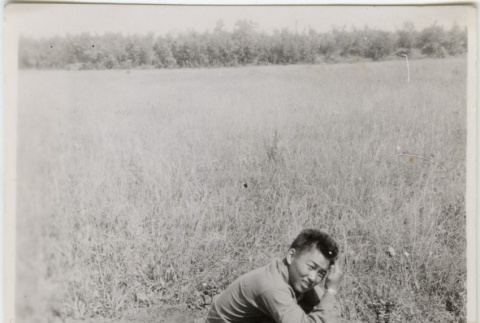 Soldier crouched on ground (ddr-densho-201-91)