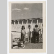 Woman stands in front of a dam (ddr-densho-404-409)