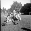 Man sitting with park with Masako and Norman Takahashi (ddr-densho-426-928)