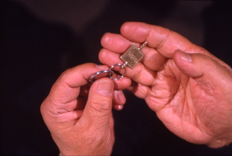 Hands and Phi Beta Kappa key (ddr-densho-1007-491)