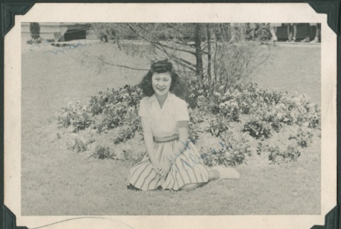 Woman sits by flowers (ddr-densho-321-121)