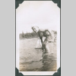 Photo of a boy playing with a toy boat (ddr-densho-483-1204)