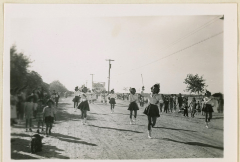 Majorettes march in an Armistice Day parade (ddr-densho-37-1159)