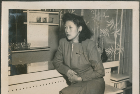 Woman sitting on bench (ddr-densho-316-418)