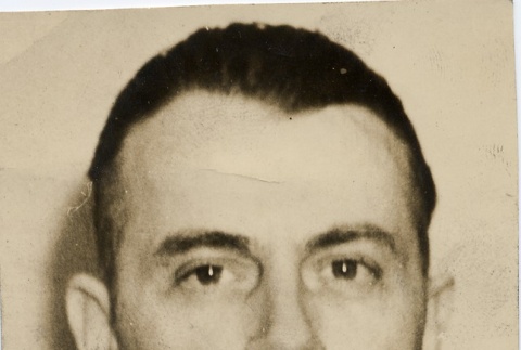 A man wearing leis (ddr-njpa-1-1373)