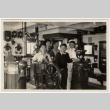 Group of men and crew in wheelhouse of ship (ddr-densho-426-874)