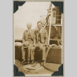 Two men sitting on deck of ship (ddr-densho-383-157)