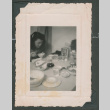 Woman eating at a table (ddr-densho-463-109)