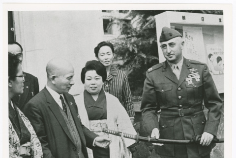 Captain Abie Gordon returns Bizen Osafune heirloom sword to Isamu Nagano (ddr-densho-1007-242)