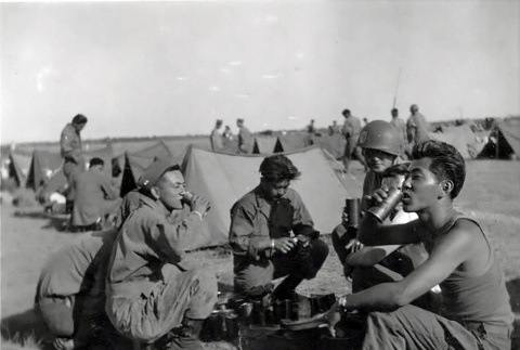 Group of soldiers drinking in field of tents (ddr-densho-474-242)