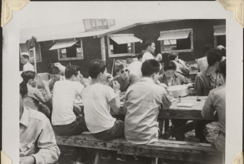 Men sitting at tables, eating (ddr-densho-466-871)