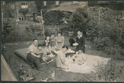 Family at a backyard picnic (ddr-densho-523-96)