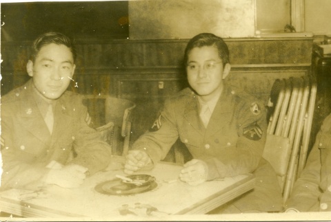 Three soldiers at a table (ddr-densho-22-389)