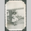 Carolyn Kawashima sitting on a fence (ddr-densho-328-181)