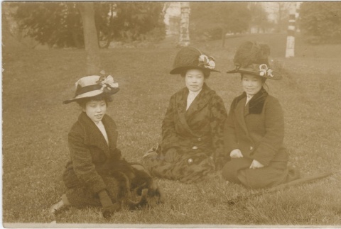 Two women and a girl seated outside (ddr-densho-321-516)