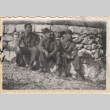Three soldiers sitting by stone wall (ddr-densho-466-247)