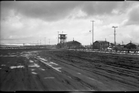 Gate Number 3 from outside camp looking along the perimeter (ddr-densho-570-46)