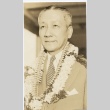 A man wearing leis (ddr-njpa-1-1266)