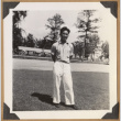 Gary Kikawa on a lawn (ddr-densho-542-143)