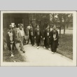 A group of women and men walking on a pathway (ddr-njpa-13-1367)