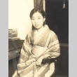 Woman seated at a desk (ddr-njpa-4-2301)