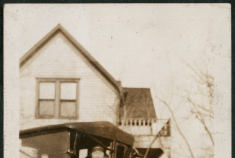 Two adults and a child next to car (ddr-densho-293-64)