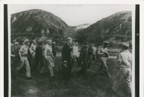 Servicepeople walking near hillside (ddr-densho-1007-176)