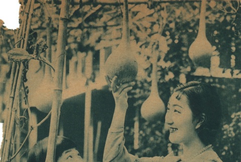 Shizue Natsukawa looking at gourds (ddr-njpa-4-1387)