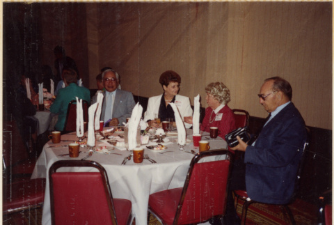 Two couples sitting at table (ddr-densho-466-433)
